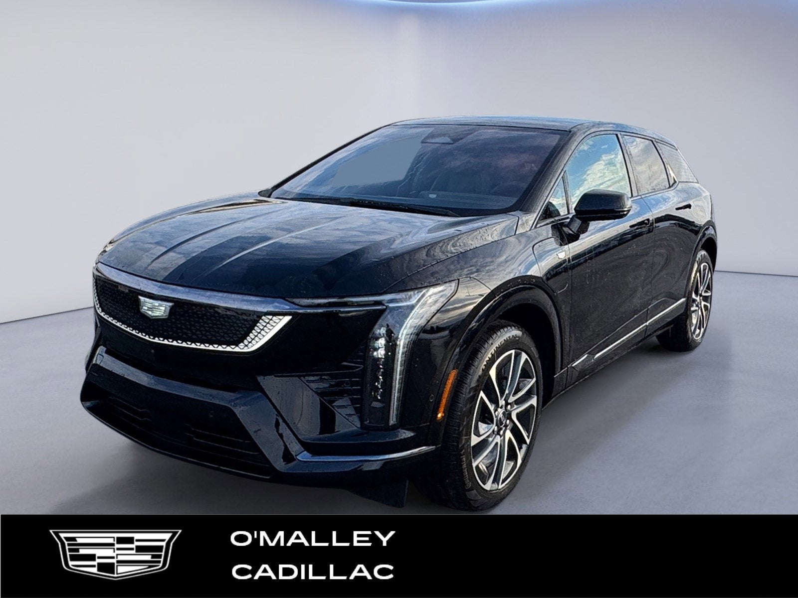 2026 Cadillac OPTIQ Sport in Black Raven — front three-quarter view